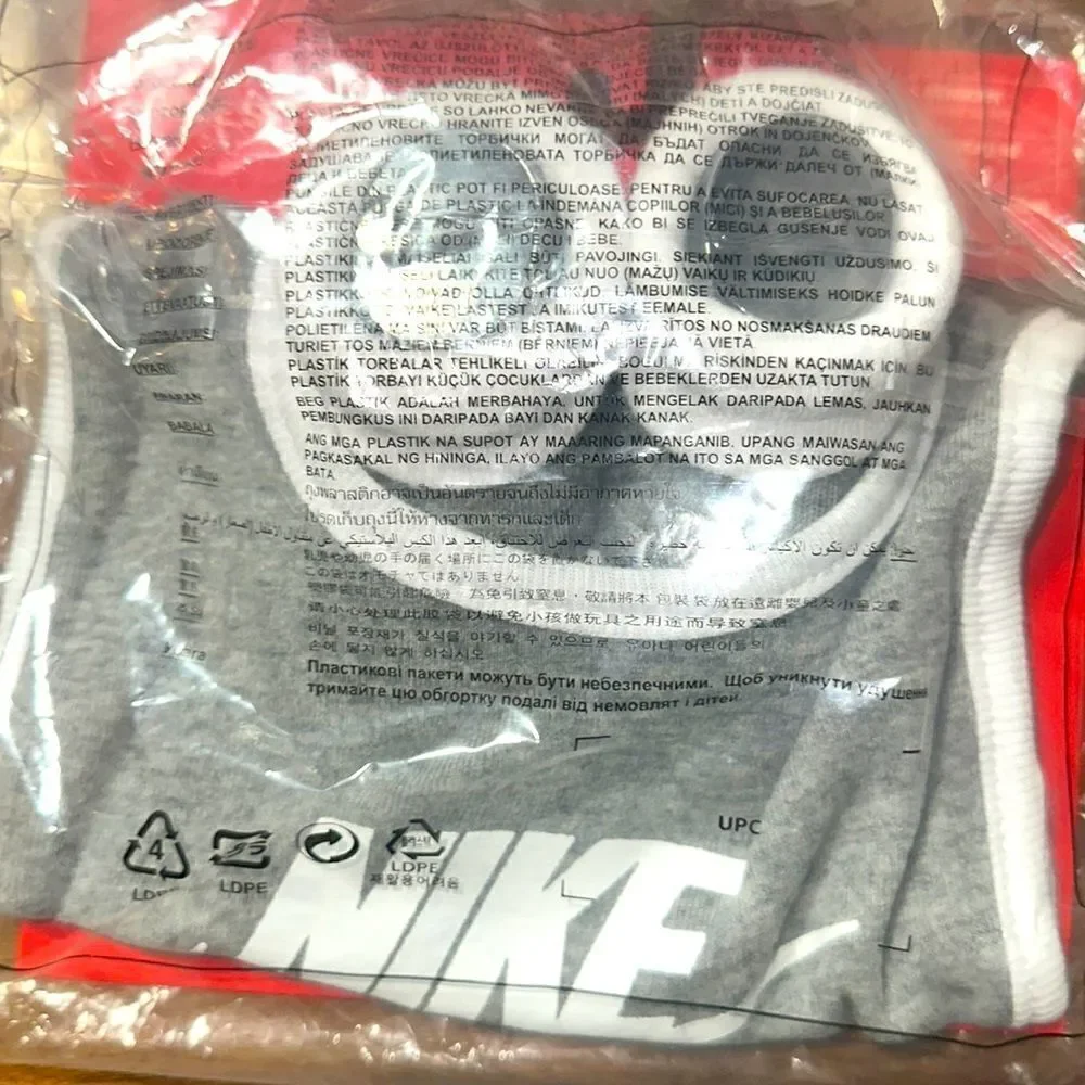 Brand New in wrapper Nike Baby Bib and Booties size 0-6 Months
